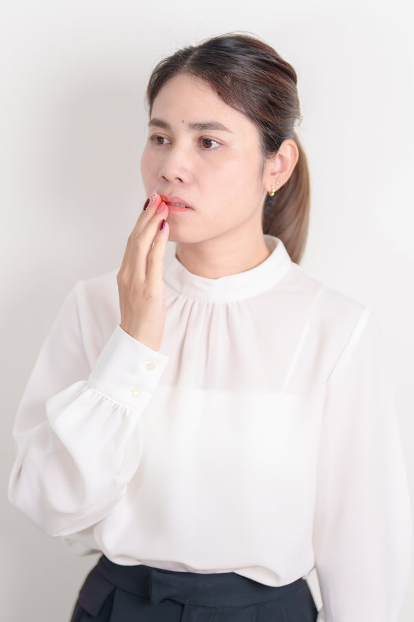 Business woman having Mouth ache for concepts of Mouth Ulcer Sore, Aphthous Stomatitis, Oral Lesions, Halitosis, Oral Health Care, Toothache and Gum Disease, Dental Caries, Gingivitis and Periodontal
